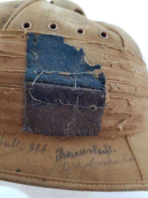 WWII Pith Helmet "Possibly DLI" with +/- 60 Signatures. Helmet has seen better days.