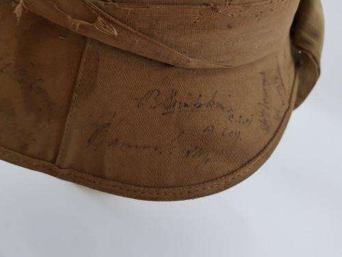 WWII Pith Helmet "Possibly DLI" with +/- 60 Signatures. Helmet has seen better days.