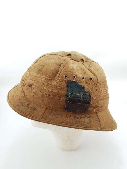 WWII Pith Helmet "Possibly DLI" with +/- 60 Signatures. Helmet has seen better days.