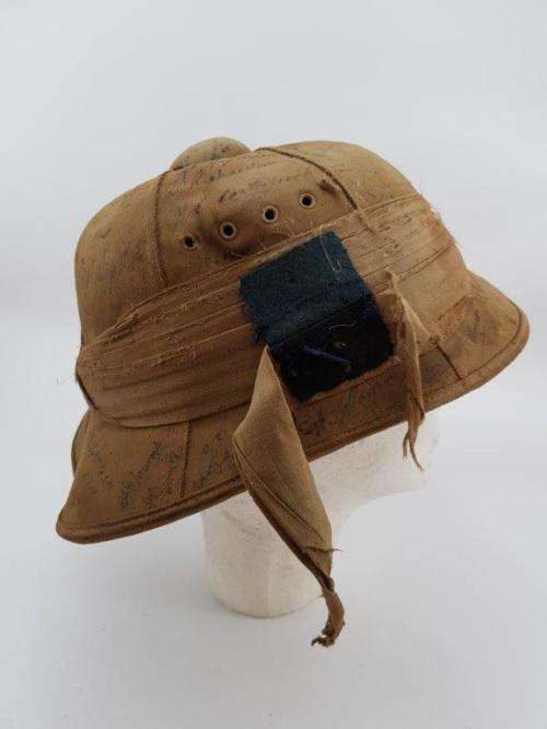 WWII Pith Helmet "Possibly DLI" with +/- 60 Signatures. Helmet has seen better days.