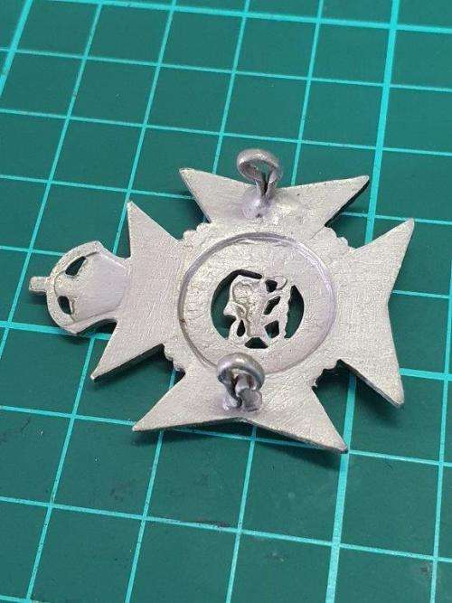 The Royal Rhodesia Regiment cap badge.
