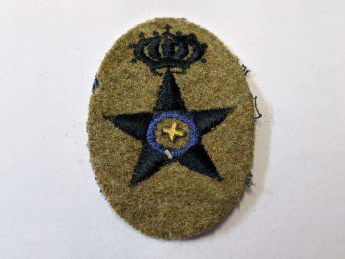 Italian WWII Supply Corps cap badge.