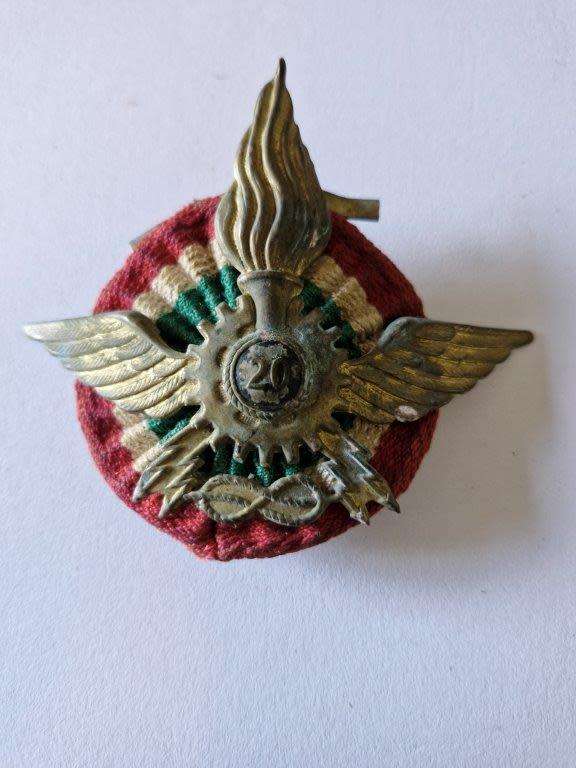 Italian WWII Motor Transport Badge with all original fastening plates and cloth backing.