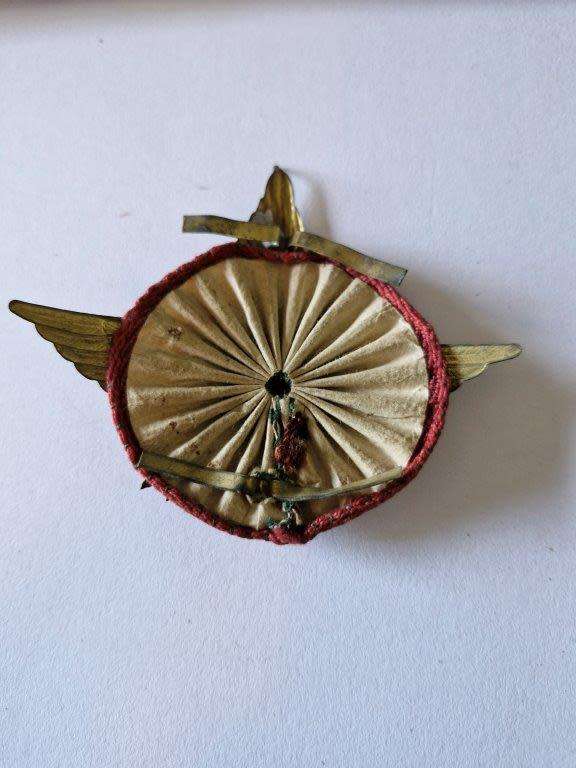 Italian WWII Motor Transport Badge with all original fastening plates and cloth backing.