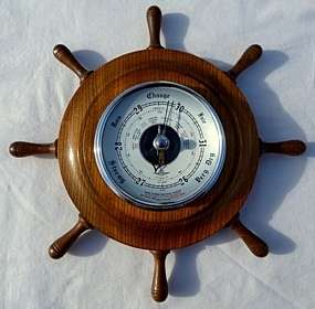 SHIPS WHEEL BAROMETER,DIAMETER 27 cm. EXCELLENT CONDITION,SOLID WOOD,ENGLAND