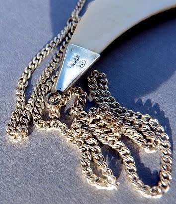 CARVED ELEPHANTS, PENDANT STERLING SILVER AND IVORY. ON SILVER CHAIN.VINTAGE BUT AS NEW.