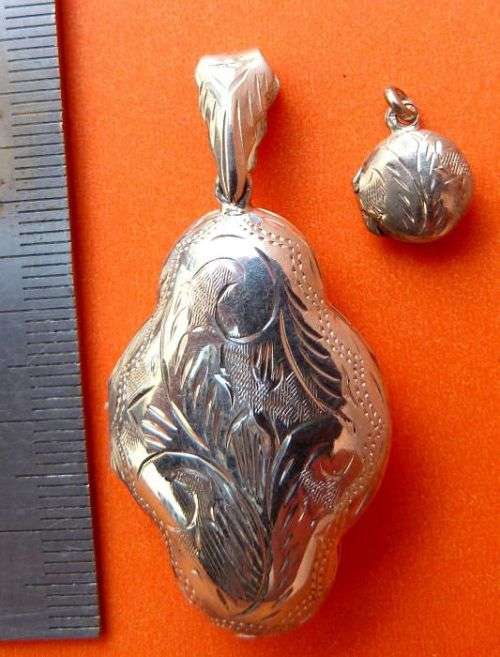2 STERLING SILVER LOCKETS / PENDANTS. BEAUTIFUL ENGRAVINGS.