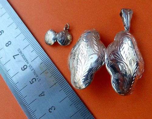 2 STERLING SILVER LOCKETS / PENDANTS. BEAUTIFUL ENGRAVINGS.