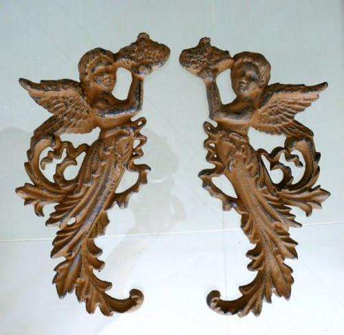 A PAIR OF CAST IRON ANGELS