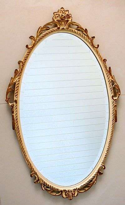 CUT GLASS MIRROR IN CARVED WOODEN FRAME,GILTED AND PAINTED