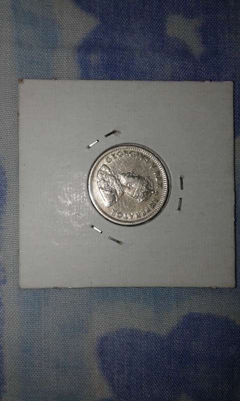1926 SIX PENCE COIN IN A SUPERB CONDITION.R10000.00 in unc