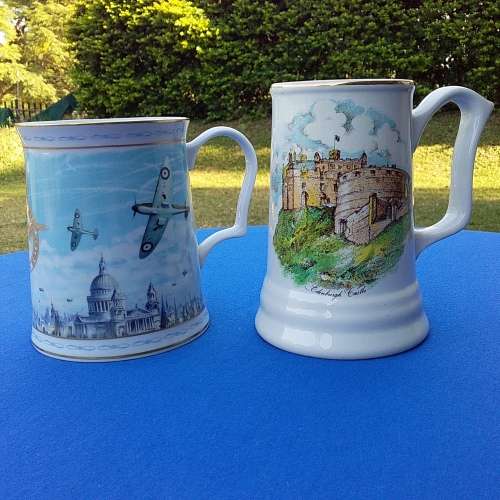 Two Tankards. One is Stoke-on-Trent and the other is a commemorative one. Good condition