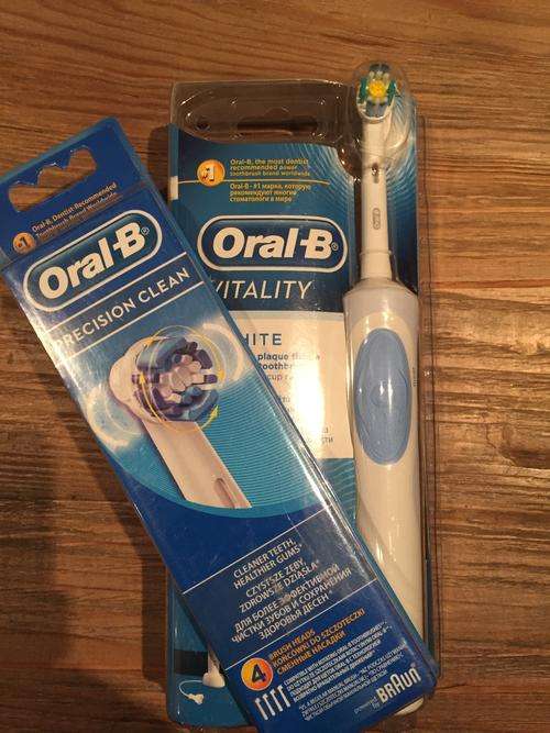 Oral B Vitality and 4 brushes