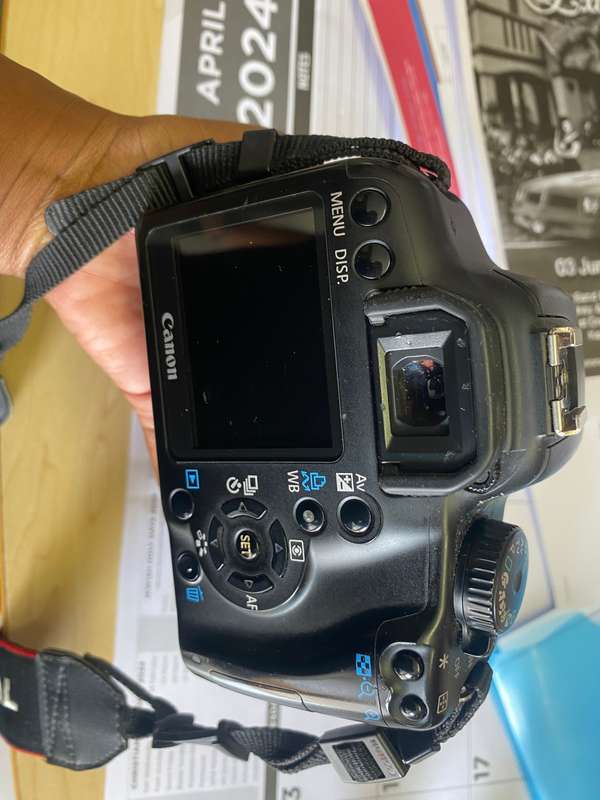 Canon 1000D camera with lens,battery,and charger