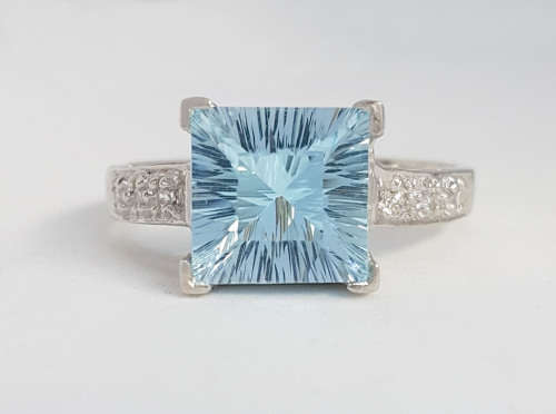 *CD DESIGNER JEWELRY* Blue Topaz and CZ Ring in Silver- Size 6