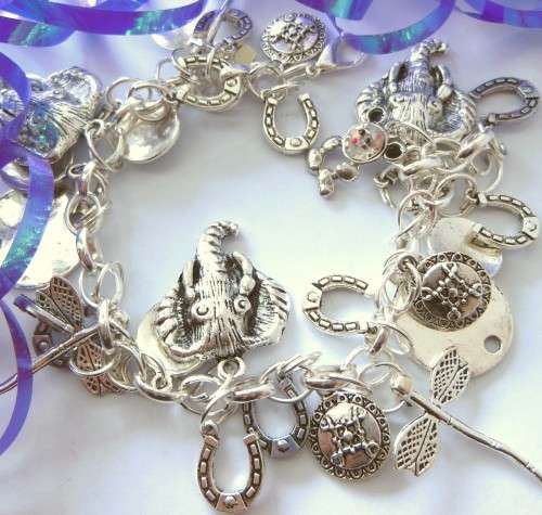 Silvertone Charm Bracelet with Elephant, Horse Shoe and Firefly Charm
