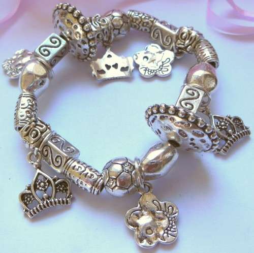 Silvertone Elastic Charm Bracelet with Crown and Floral Style Charm