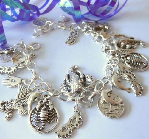 Silvertone Charm Bracelet with Elephant, Bird, Scorpion and Crown Charms