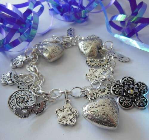 Silvertone Charm Bracelet with Heart, Mask and Floral Style Charm