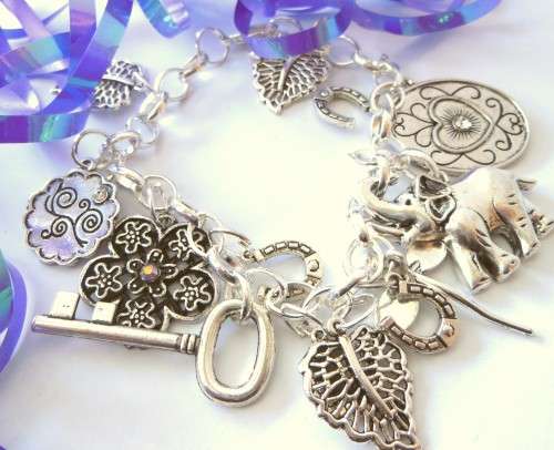 Silvertone Charm Bracelet with Key, Elephant, Leaf and Dragon Fly Charms