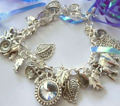 Silvertone Elastic Charm Bracelet with Elephant, Leaf and Rhinestone Crystal Charm