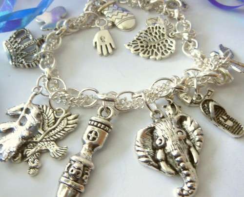 Silvertone Charm Bracelet with Leave, Horse shoe, Gloves and Elephant Charm
