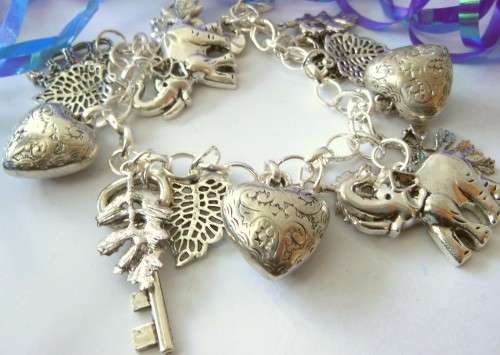 Silvertone Charm Bracelet with Key, Crown, Heart and Clover Charm