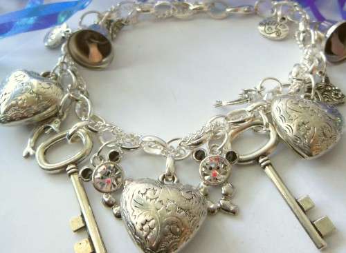 Silvertone Charm BRacelet with Key, Heart and Bell Charm