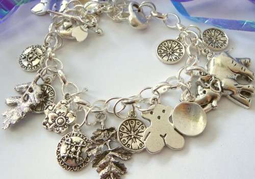 Silvertone Charm Bracelet with Elephant, Leaf and Round Disk Type Charms