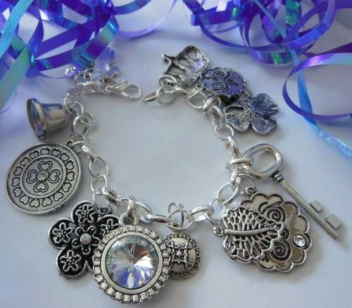 Silvertone Charm Bracelet with Key, Crown and Rhinestone Crystal type Charms