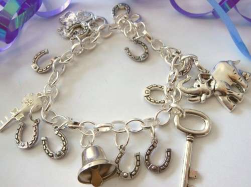 Silvertone Charm Bracelet with Bell, Horse shoe and Key type Charms