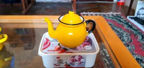 Yellow enamel tea pot