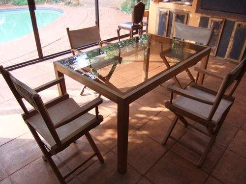 R50!!-Four Chairs and table with glass top!