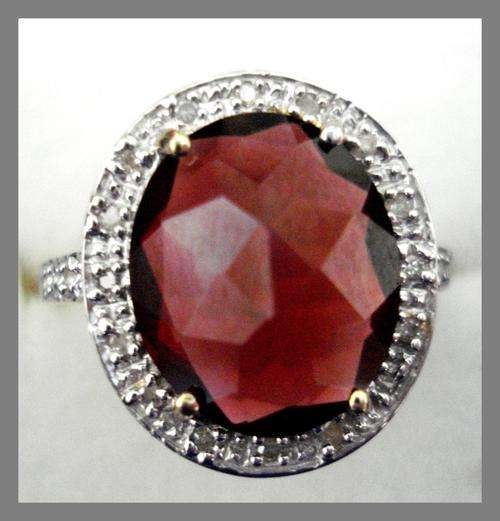 LOVELY GARNET RING SET IN 10CT WHITE GOLD WITH DIAMONDS