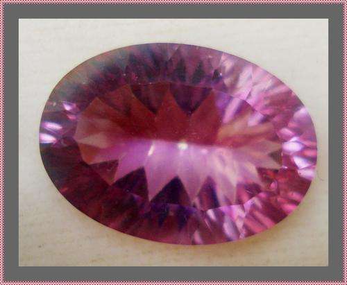 STUNNING  OVAL BRIGHT PINK TOPAZ - CONCAVE   5.80 CT
