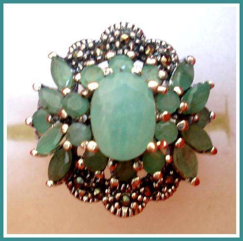 STUNNING, .925  STERLING SILVER RING WITH NATURAL EMERALDS