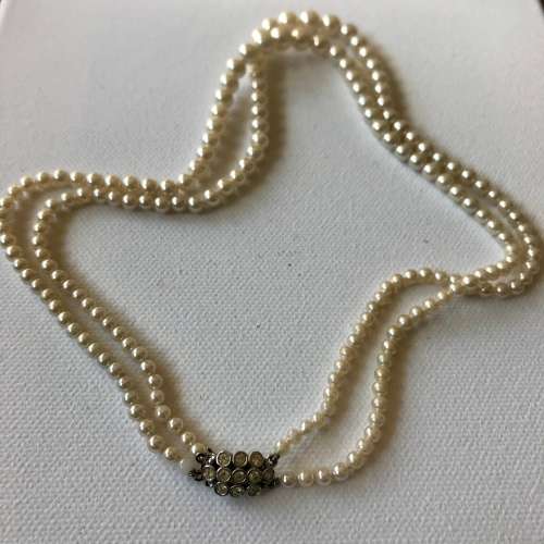 Vintage double strand faux pearl necklace with rhinestone clasp signed Metall