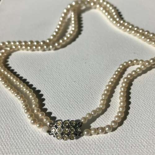 Vintage double strand faux pearl necklace with rhinestone clasp signed Metall