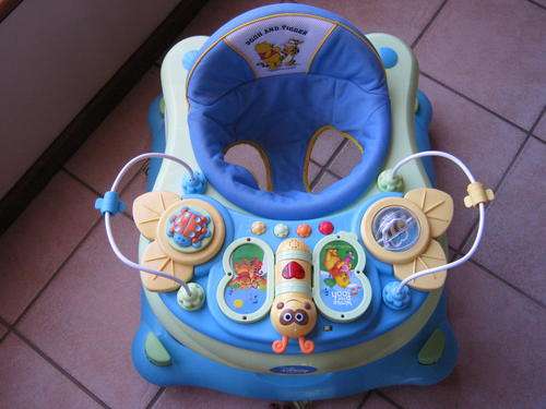 Disney`s Winnie The Pooh Baby Walking Ring, 7 wheeler very good condition.