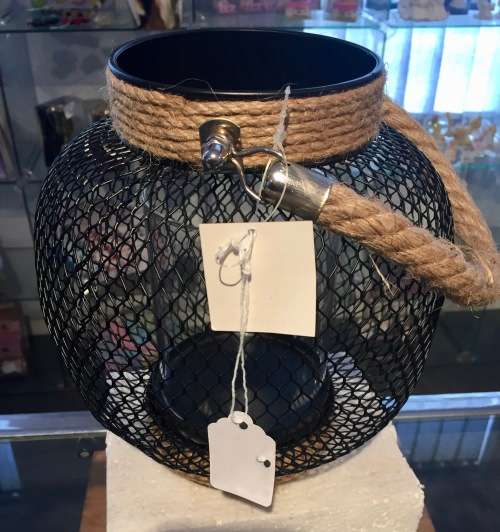 Outdoor lantern with glass candle holder inside