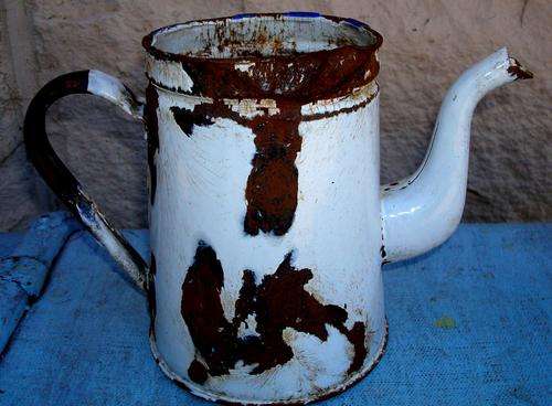 Old Rusted Coffie Pot.