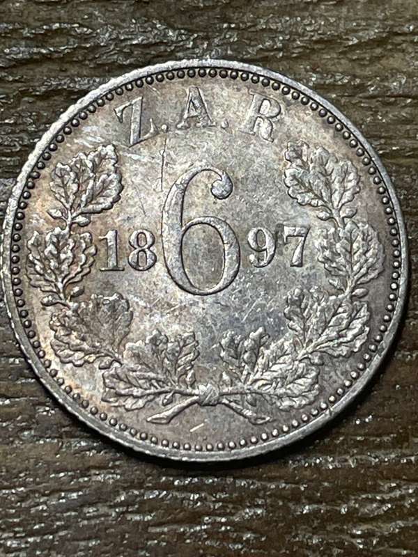 1897 * 6 pence * at least au