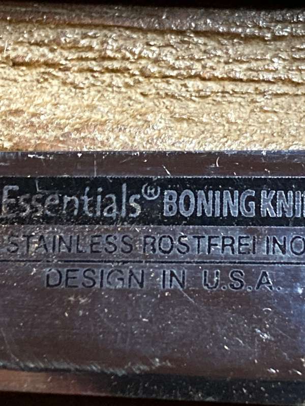 Boning knife in leather sheath