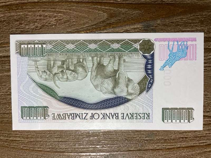 Zimbabwe   *  $1000  *  issued 2003  *  au left slight fold