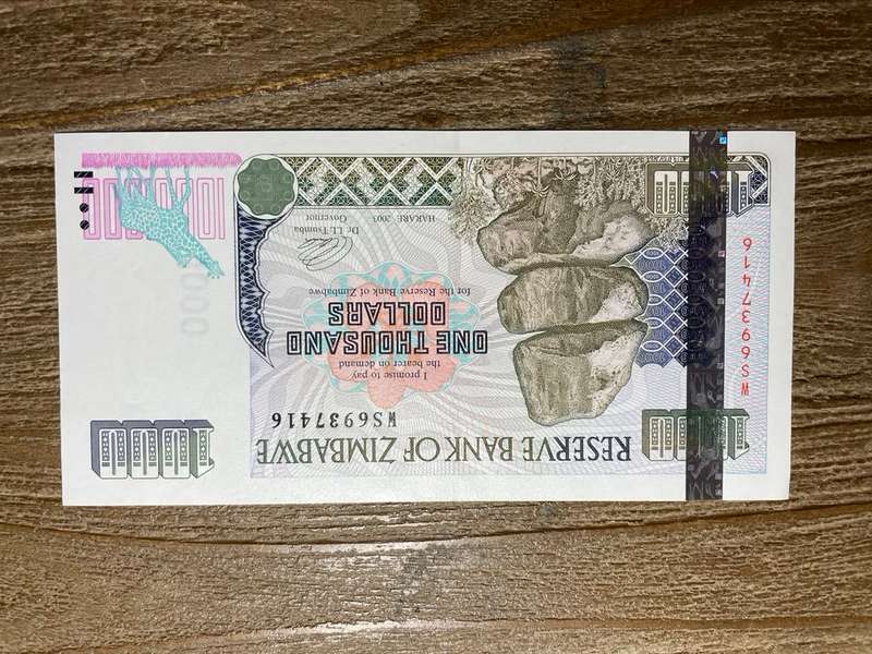 Zimbabwe   *  $1000  *  issued 2003  *  au left slight fold