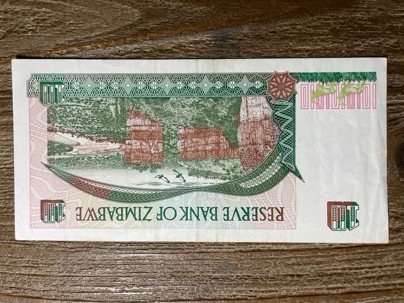 Zimbabwe   *  $10  *  issued 1997  *  au note not unc