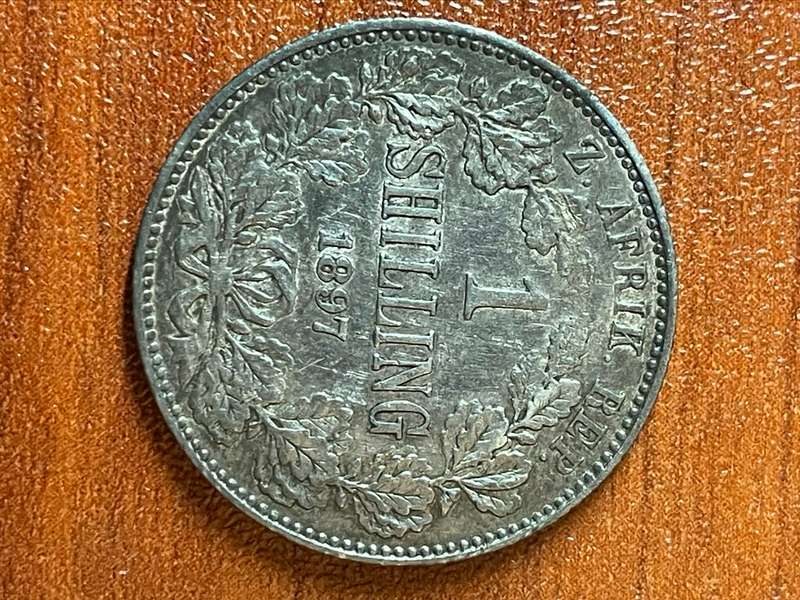 1897 *** Shilling *** ZAR *** decent and hair still prominent, photo does not do it justice