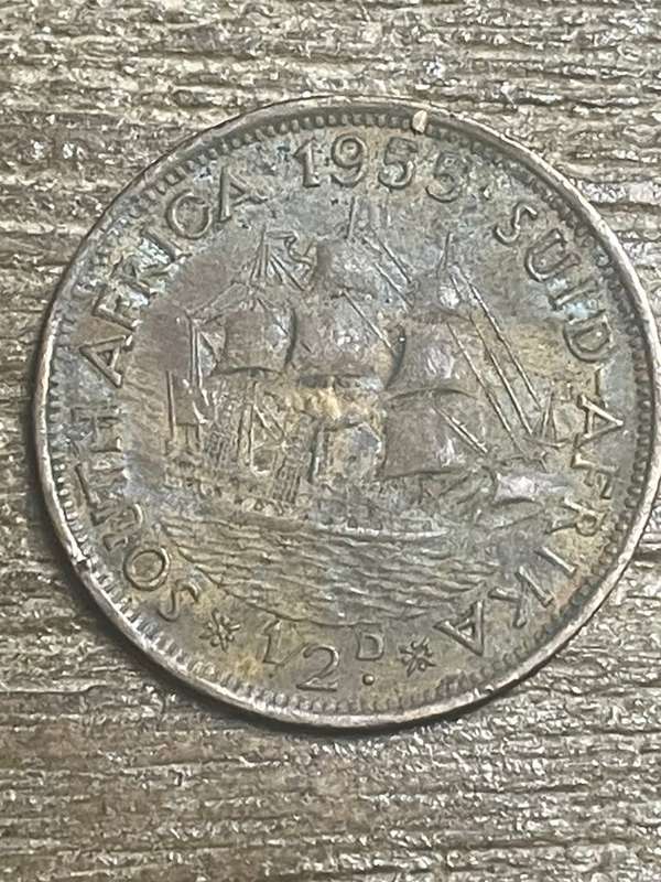 1955 *** 1/2 Penny *** the top stains can removed as coin better than picture