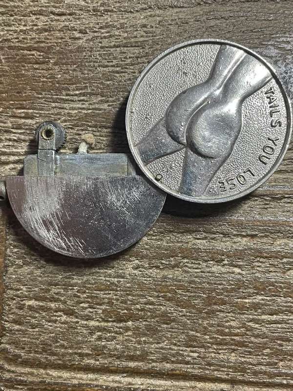 Unusual coin/ lighter *** Heads or tails *** Great price ..