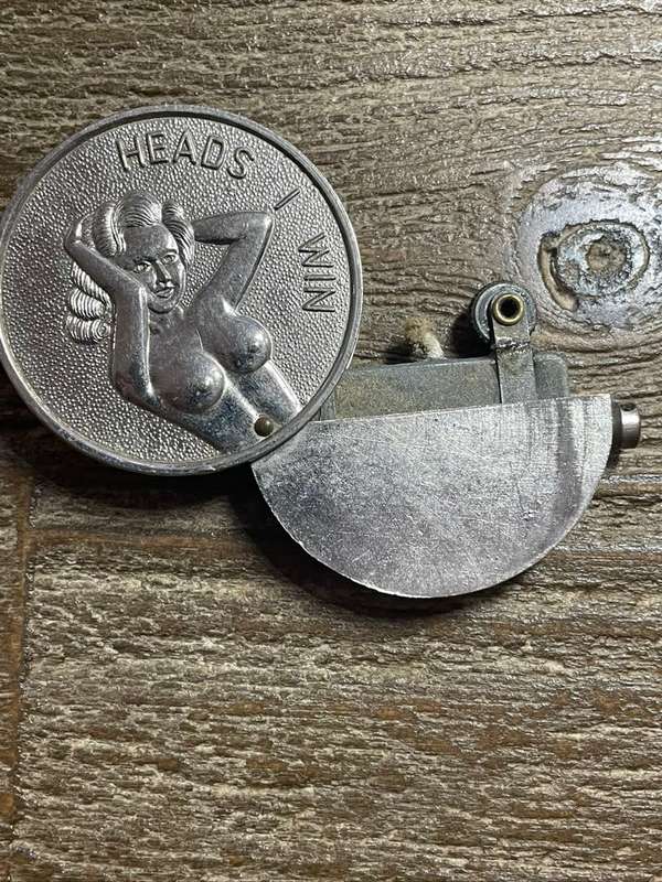 Unusual coin/ lighter *** Heads or tails *** Great price ..